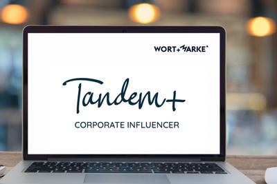Foto von Bildschirm eines Laptops mit Schrift Tandem+ Corporate Influencer GOLDSTÜCK